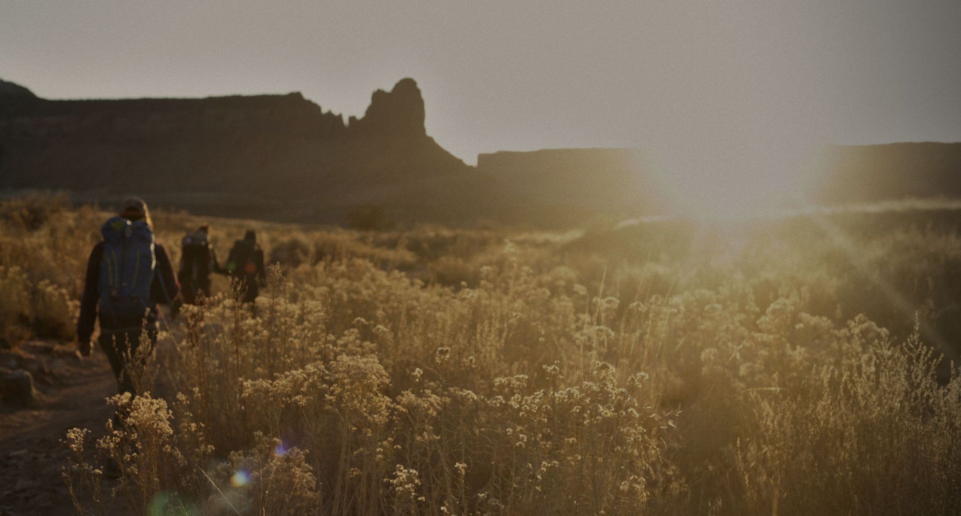 Climbers walking in Indian Creek, Utah